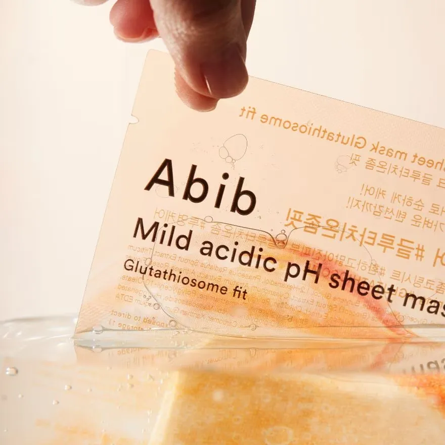 Abib mild acidic pH sheet mask packaging held by a hand